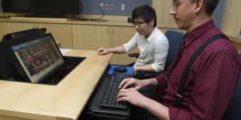 A researcher works on a scientific paper